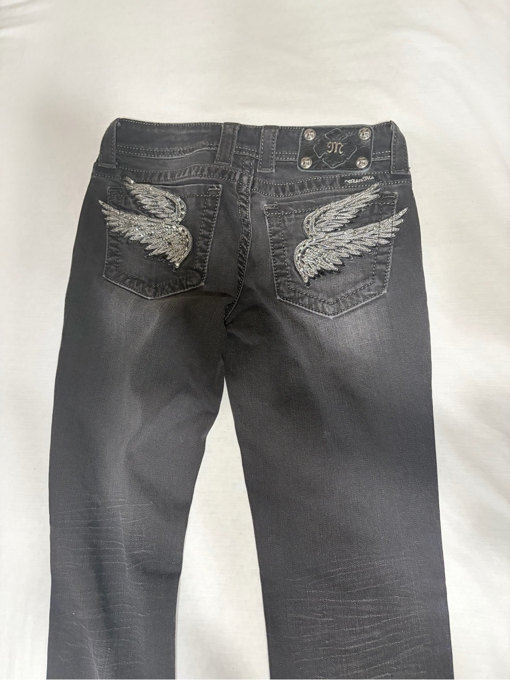 MISS ME Black Women's Skinny Jeans with Silver Wing Embroidery on back pockets.